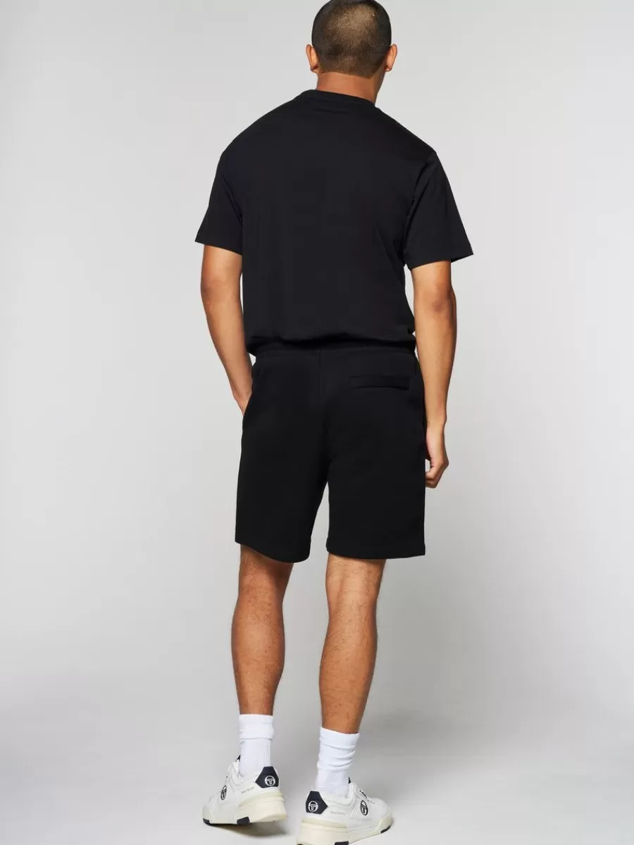 Sergio Tacchini - Línea Esencial: Pantalones Cortos Vintage en Negro Puro 

(Alternativa opcional si requiere variación: Sergio Tacchini - Colección Clásica: Shorts Retro con Detalles en Ébano Urbano)
