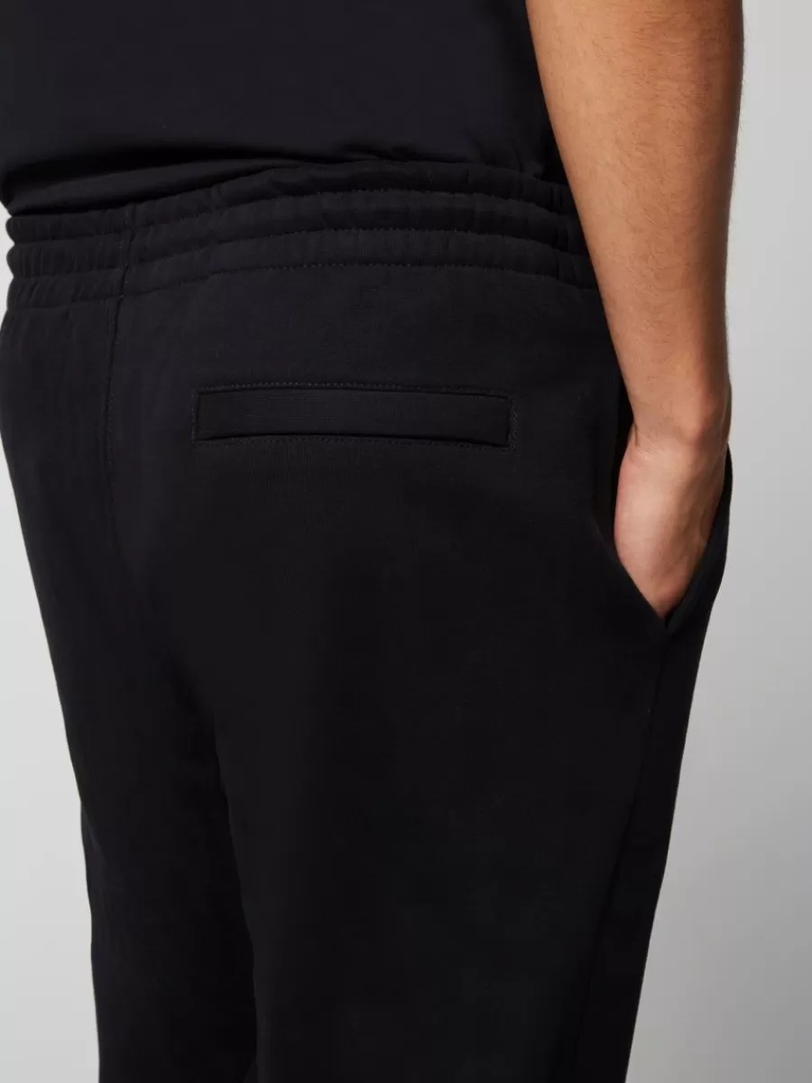 Sergio Tacchini - Pantalón Deportivo Clásico de Colección Esencial en Negro Sofisticado

(Alternativa 1: Pantalón de Entrenamiento Premium Sergio Tacchini - Línea Heritage en Color Ébano Elegante)

(Alternativa 2: Pantalón Casual Sergio Tacchini Edición Clásica - Tono Negro Profundo con Corte Relajado)